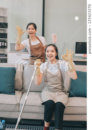 Cleaners clean empty office spaces Cleaners clean empty office spaces 135423370