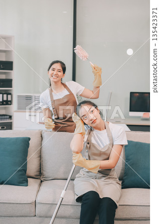Cleaners clean empty office spaces 135423371