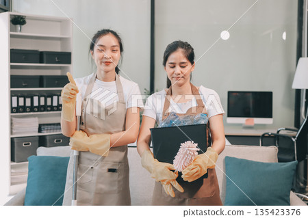 Cleaners clean empty office spaces Cleaners clean empty office spaces 135423376