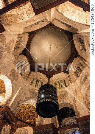 Interior view of the Qalawun Complex on Al-Muizz Street. Features intricate Islamic architecture, domed ceiling, and decorative elements. Interior view of the Qalawun Complex on Al-Muizz Street. Features intricate Islamic architecture, domed ceiling, and decorative elements. 135424069