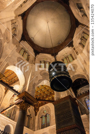 Interior view of the Qalawun Complex on Al-Muizz Street. Features intricate Islamic architecture, domed ceiling, and decorative elements. 135424070