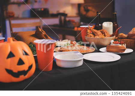 Friends enjoying a Halloween party at a bar making a toast 135424091