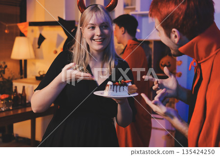 Friends enjoying a Halloween party at a bar making a toast Friends enjoying a Halloween party at a bar making a toast 135424250