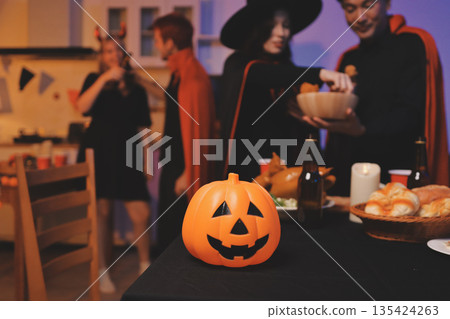 Friends enjoying a Halloween party at a bar making a toast Friends enjoying a Halloween party at a bar making a toast 135424263