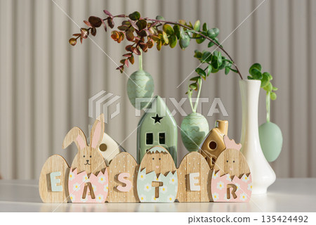 Wooden Easter Letter Eggs with Bunny and Chick Figures. Festive Spring Decor 135424492