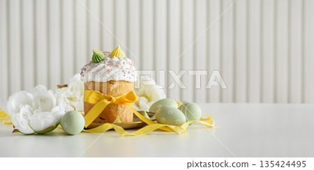 Easter Cake Decorated Yellow Ribbon with Flowers and Pastel Eggs on White Background Easter Cake Decorated Yellow Ribbon with Flowers and Pastel Eggs on White Background 135424495