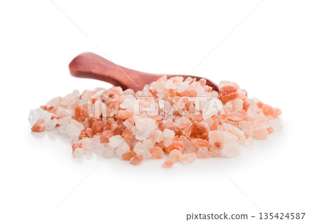 Pink Himalayan salt isolated on white background. Pink Himalayan salt isolated on white background. 135424587
