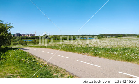 A road with a white line down the middle. A road with a white line down the middle. 135424620