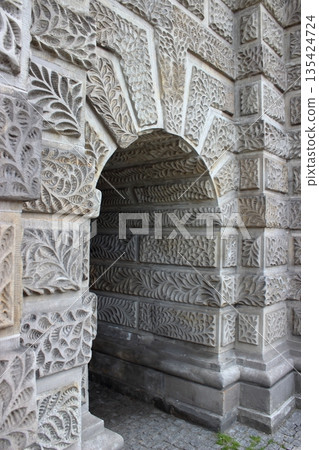 Carved stone arch detail in historic architecture 135424724