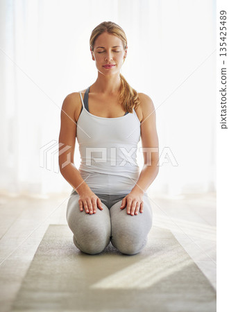 Calm woman, yoga and meditation for exercise, zen or spiritual wellness and mental health at home. Relax female person or yogi in peaceful meditating, workout or healthy mindset for awareness on mat 135425489