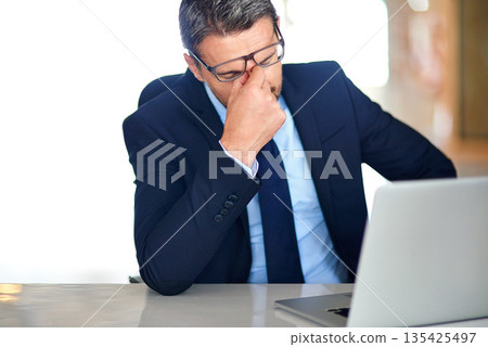 Business, stress or man with a headache, laptop or stock market crisis with error, sales or bankruptcy. Male person, ceo or employee with a pc, migraine or depression with risk management or burnout 135425497