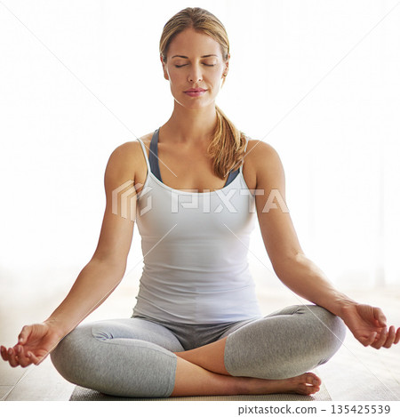 Calm woman, yoga and meditation on mat for zen workout, spiritual wellness or healthy exercise at home. Relaxed female person or yogi meditating for mindfulness or awareness on living room floor Calm woman, yoga and meditation on mat for zen workout, spiritual wellness or healthy exercise at home. Relaxed female person or yogi meditating for mindfulness or awareness on living room floor 135425539