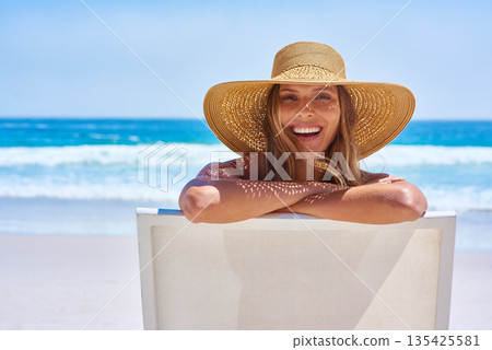 Portrait, beach and woman with a smile, holiday and summer getaway with tourism, break or travelling. Face, female person or girl on a chair, seaside vacation or travel with a hat or relax with waves Portrait, beach and woman with a smile, holiday and summer getaway with tourism, break or travelling. Face, female person or girl on a chair, seaside vacation or travel with a hat or relax with waves 135425581