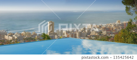 Travel, ocean and infinity pool in city on vacation and hotel view in Cape Town with nobody, buildings and urban beach property. Cityscape, sea and sky at luxury accommodation for summer holiday trip 135425642