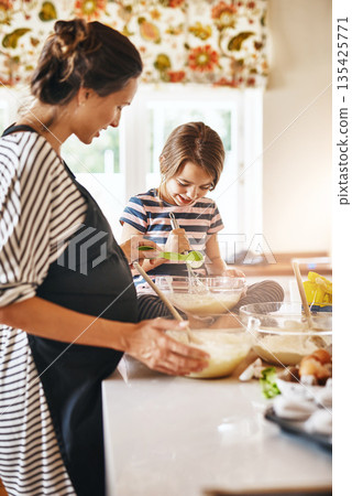 Mother, pregnant or girl baking in kitchen as a happy family with a kid learning cookies or cake recipe at home. Maternity, cooking or mother baker helping or teaching child to bake for development Mother, pregnant or girl baking in kitchen as a happy family with a kid learning cookies or cake recipe at home. Maternity, cooking or mother baker helping or teaching child to bake for development 135425771