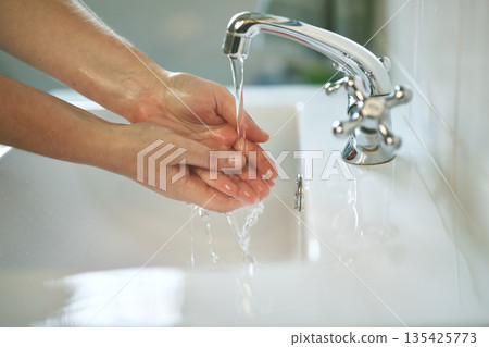 Clean, bathroom and hands with water for wash or dirt, bacteria and safety from germs at home. Woman, cleaning and hand for self care for healthy person for disinfection and hygiene at the house. 135425773
