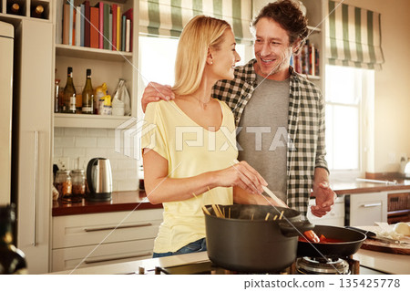 Dinner, support or happy couple kitchen cooking with healthy food or vegetables for lunch together at home. Affection or woman helping, speaking or talking to husband in meal prep in Australia Dinner, support or happy couple kitchen cooking with healthy food or vegetables for lunch together at home. Affection or woman helping, speaking or talking to husband in meal prep in Australia 135425778