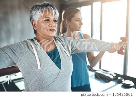 Dumbbell, physiotherapy and old woman with personal trainer for fitness, wellness or rehabilitation. Health, workout or retirement with senior patient and physiotherapist in gym for support training Dumbbell, physiotherapy and old woman with personal trainer for fitness, wellness or rehabilitation. Health, workout or retirement with senior patient and physiotherapist in gym for support training 135425861