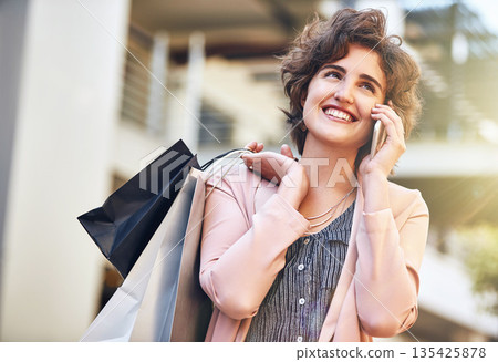 Woman, phone call and city with shopping bags, sale and happiness for discount on walk in summer. Girl, retail deal and fashion with smartphone in metro cbd with communication, promotion and clothes Woman, phone call and city with shopping bags, sale and happiness for discount on walk in summer. Girl, retail deal and fashion with smartphone in metro cbd with communication, promotion and clothes 135425878
