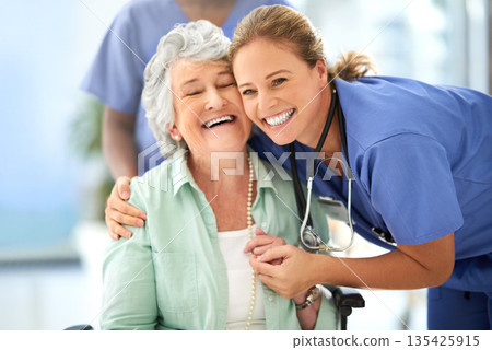 Nurse, senior woman and hug of caregiver and happy smile with support and care in hospital. Wheelchair, women and healthcare employee help with elderly female patient with love in a health clinic 135425915