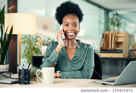 Black woman, phone call and business portrait, smile and conversation with contact. Smartphone, face and African female professional talking, listening or communication in office workplace at night. Black woman, phone call and business portrait, smile and conversation with contact. Smartphone, face and African female professional talking, listening or communication in office workplace at night. 135425972