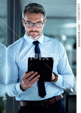 Reading email, internet and a businessman with a tablet for communication, app or legal research. Digital, corporate and a mature lawyer with technology for connection, online work or report Reading email, internet and a businessman with a tablet for communication, app or legal research. Digital, corporate and a mature lawyer with technology for connection, online work or report 135425973