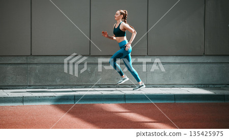 Young woman, sport running and city sidewalk with training, exercise and fitness on urban road. Street, runner profile and female athlete with mockup and workout for health, wellness and race outdoor Young woman, sport running and city sidewalk with training, exercise and fitness on urban road. Street, runner profile and female athlete with mockup and workout for health, wellness and race outdoor 135425975