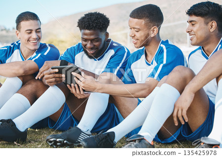 Soccer player, team or group with a tablet outdoor on field for fitness training or online game. Football, club and diversity athlete people or friends with tech to watch sports competition or video Soccer player, team or group with a tablet outdoor on field for fitness training or online game. Football, club and diversity athlete people or friends with tech to watch sports competition or video 135425978
