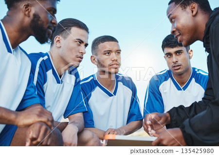 Sports, soccer coach and a team talking on a field for fitness exercise or outdoor game. Football formation, club and diversity athlete men listen to plan for coaching, scrum and training strategy Sports, soccer coach and a team talking on a field for fitness exercise or outdoor game. Football formation, club and diversity athlete men listen to plan for coaching, scrum and training strategy 135425980