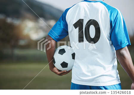 Soccer ball, sports and man with uniform number on a field for exercise, fitness and training outdoor. Football club, pitch and event or game with athlete person and mockup for sport competition Soccer ball, sports and man with uniform number on a field for exercise, fitness and training outdoor. Football club, pitch and event or game with athlete person and mockup for sport competition 135426018
