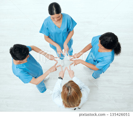 Above, star or hands of doctors in hospital with teamwork in nurses collaboration for healthcare goal. About us, team building or top view of medical group with support shape, motivation or mission Above, star or hands of doctors in hospital with teamwork in nurses collaboration for healthcare goal. About us, team building or top view of medical group with support shape, motivation or mission 135426051
