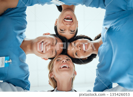 Smile, teamwork or faces of doctors in huddle laughing in collaboration together for healthcare goals. Low angle, funny team building or happy medical nurses with group support, motivation or mission Smile, teamwork or faces of doctors in huddle laughing in collaboration together for healthcare goals. Low angle, funny team building or happy medical nurses with group support, motivation or mission 135426053