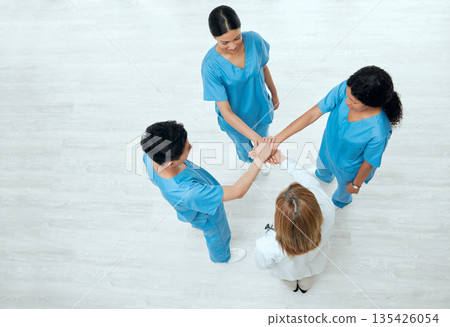 Above, teamwork or hands of nurses in collaboration in meeting for healthcare, targets or goals. About us, team building or top view of medical doctors with group support, motivation or mission Above, teamwork or hands of nurses in collaboration in meeting for healthcare, targets or goals. About us, team building or top view of medical doctors with group support, motivation or mission 135426054