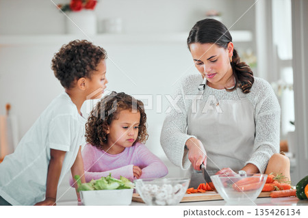 Cooking, food and cutting with family in kitchen for health, nutrition and support. Diet, vegetables and dinner with mother and children with meal prep at home for wellness, salad and learning Cooking, food and cutting with family in kitchen for health, nutrition and support. Diet, vegetables and dinner with mother and children with meal prep at home for wellness, salad and learning 135426134