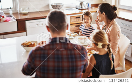 Happy family, morning and breakfast on kitchen table for meal, eating or bonding time together at home. Mother, father and children with healthy food to start the day for nutrition or cereal in house 135426251
