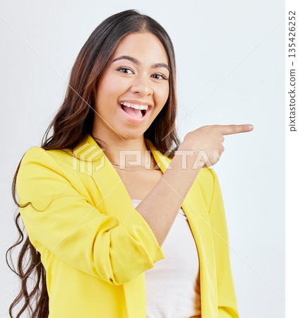 Studio portrait, excited and business woman pointing at sales product space, retail promotion or corporate announcement. Commercial promo, happy gesture and professional person on white background Studio portrait, excited and business woman pointing at sales product space, retail promotion or corporate announcement. Commercial promo, happy gesture and professional person on white background 135426252