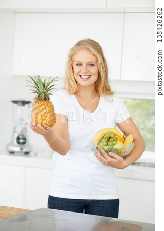 Fruits, pineapple or portrait of happy woman with healthy lunch or breakfast meal or diet in kitchen at home. Morning, smile or vegan girl with natural food to lose weight for gut health or wellness 135426262