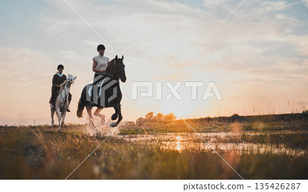 Horse riding, friends and girls in countryside at sunset with outdoor mockup space. Equestrian, happy women and animals in water, nature and adventure to travel, journey and summer vacation together. Horse riding, friends and girls in countryside at sunset with outdoor mockup space. Equestrian, happy women and animals in water, nature and adventure to travel, journey and summer vacation together. 135426287