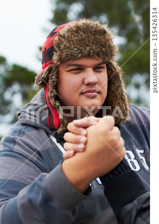 Man, arm wrestling and outdoor for sports, challenge and exercise with rival. Strong, conflict and people holding hands for competition, serious power and muscle match, training and workout at park. 135426314