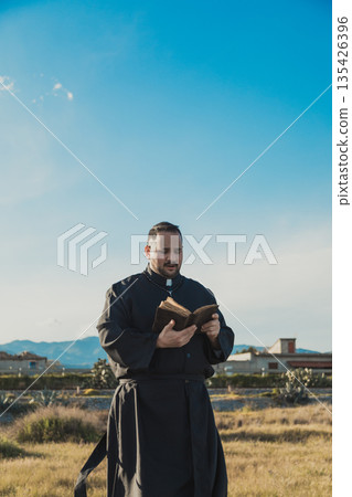 Priest Spreading The Words Of God In The Nature Priest Spreading The Words Of God In The Nature 135426396