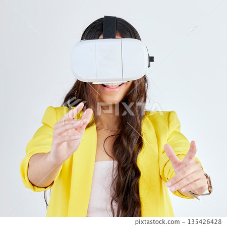 Virtual reality, metaverse and happy woman with technology in studio isolated on a white background. Vr, futuristic and person with digital 3d glasses for fantasy experience, cyber gaming or internet Virtual reality, metaverse and happy woman with technology in studio isolated on a white background. Vr, futuristic and person with digital 3d glasses for fantasy experience, cyber gaming or internet 135426428