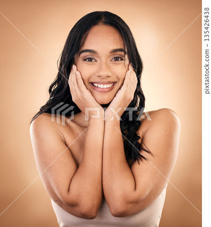 Portrait, happy woman and skincare touch for beauty isolated on a brown background in studio. Face, natural cosmetics and smile of model with spa treatment for aesthetic, wellness and skin health. Portrait, happy woman and skincare touch for beauty isolated on a brown background in studio. Face, natural cosmetics and smile of model with spa treatment for aesthetic, wellness and skin health. 135426438