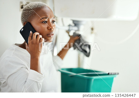 Phone call for plumbing service, woman in bathroom and help from expert contractor to fix leak. Stress, African person on cellphone and problem with pipes in home, professional advice for maintenance 135426447
