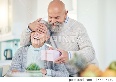 Old couple, surprise and gift with anniversary, happiness and retirement with marriage, love or relationship. Happy, senior man or elderly woman with a present, home or cheerful with romance or smile Old couple, surprise and gift with anniversary, happiness and retirement with marriage, love or relationship. Happy, senior man or elderly woman with a present, home or cheerful with romance or smile 135426459