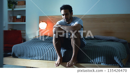 Night, lonely and man thinking with depression, mental health or insomnia from sad memories in bedroom. Late, contemplation or anxious person with grief, worry and sleepless from stress in apartment. 135426470