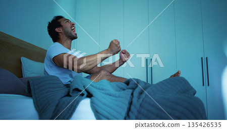 Insomnia, night and man in bedroom with scream for burnout, exhausted and fatigue for mental health. Tired, dark and person with upset, angry and shout for sleepless, bad dream and frustrated in home 135426535