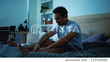Night, stress and sad man with depression, mental health and sleepless from lonely memories in bed. Late, contemplation and upset person with anxiety, grief and insomnia with thinking in apartment. 135426600