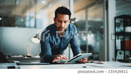 Finance, review or analyst in office with tablet, funding ideas or data analysis for budget pitch. Research, paper and man in agency with tech, online report or proposal update for investment plan. Finance, review or analyst in office with tablet, funding ideas or data analysis for budget pitch. Research, paper and man in agency with tech, online report or proposal update for investment plan. 135426611