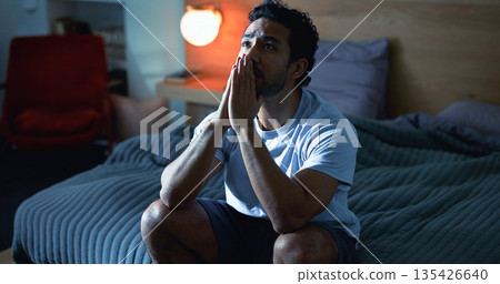 Night, stress and thoughtful man with anxiety, mental health and prayer for insomnia in bedroom. Late, contemplation and anxious person with depression, grief and praying for sleeplessness in house. 135426640