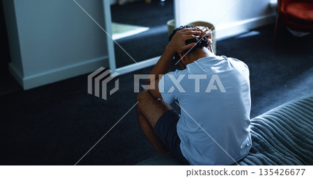 Insomnia, night and above of man in bedroom with stress for burnout, exhausted and fatigue for mental health. Home, dark and person with upset, sad and frustrated for sleepless, bad dream and tired 135426677